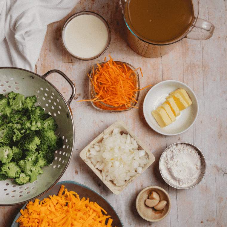 Ingredients needed for Easy Ninja Foodi Broccoli Cheddar Soup on kitchen table.