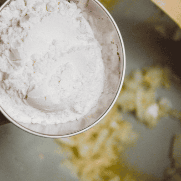 All-purpose flour being stirred into the Ninja Foodi to form a smooth, gravy-like mixture before adding chicken broth.