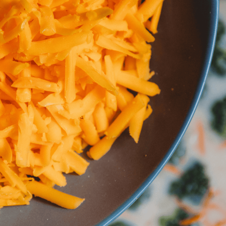 Broccoli, carrots, milk, cream, and cheddar simmering together in the Ninja Foodi until tender and hot.