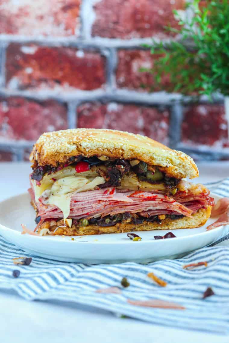 Air Fryer Muffaletta Sandwich with melted cheese, savory meats, and olive salad, perfectly crisped in the air fryer."
