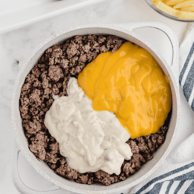 Browning ground beef and diced onion in a skillet