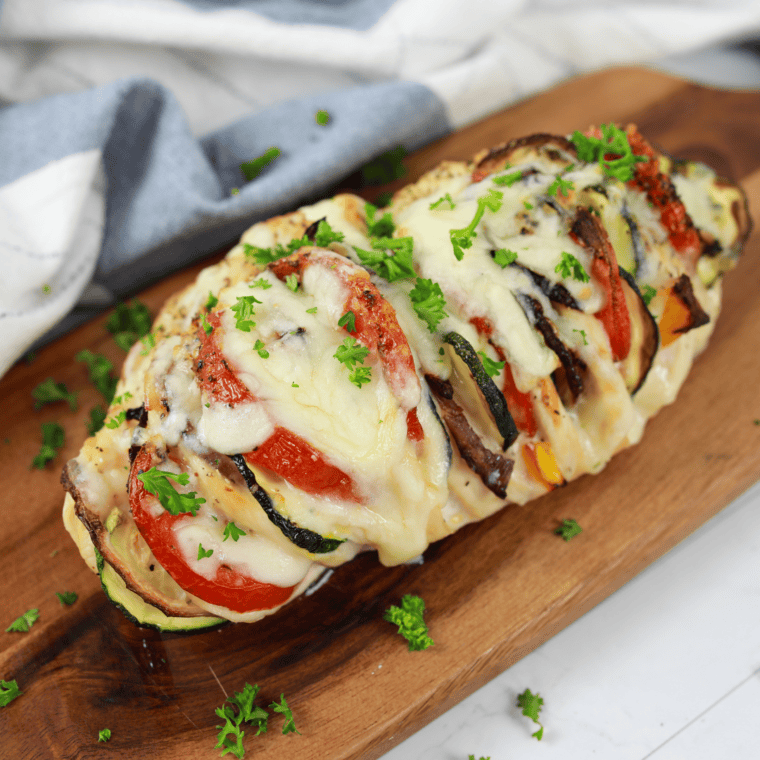 Air Fryer Primavera Stuffed Chicken with fresh vegetables.