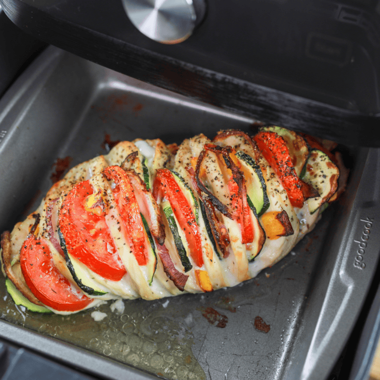 Finished Air Fryer Primavera Stuffed Chicken – Fully cooked stuffed chicken, golden and ready to serve.