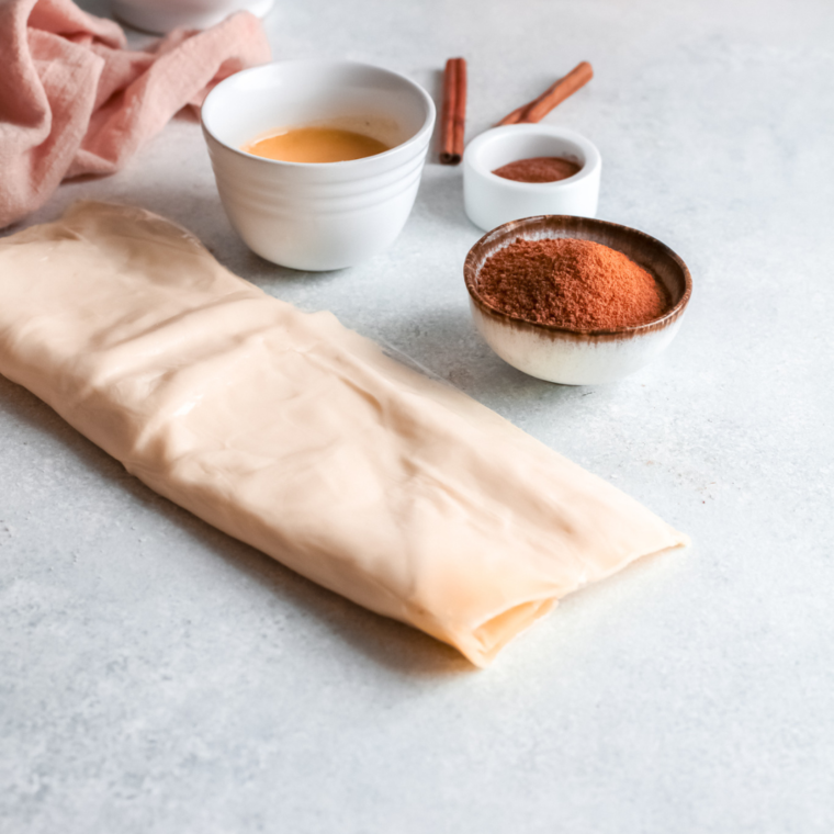 Ingredients needed for Air Fryer Pumpkin Cinnamon Rolls on kitchen table.