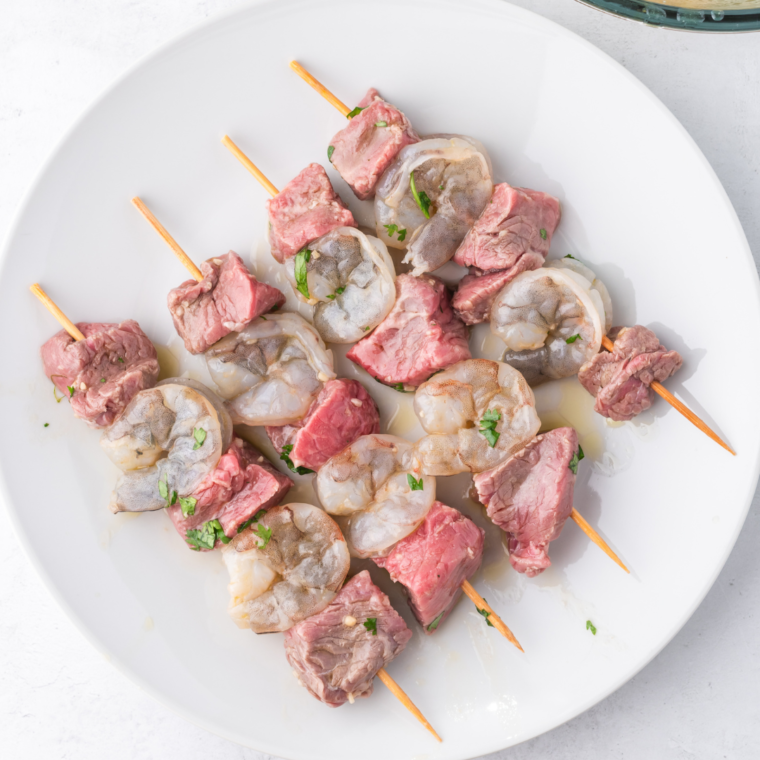 "Preheated air fryer at 400°F, ready for surf and turf kebabs to be cooked to perfection."
