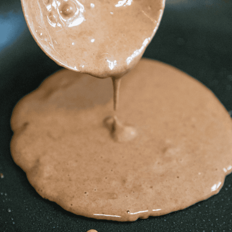 Preheating griddle or skillet on medium-low heat with light oil or butter coating for pancakes