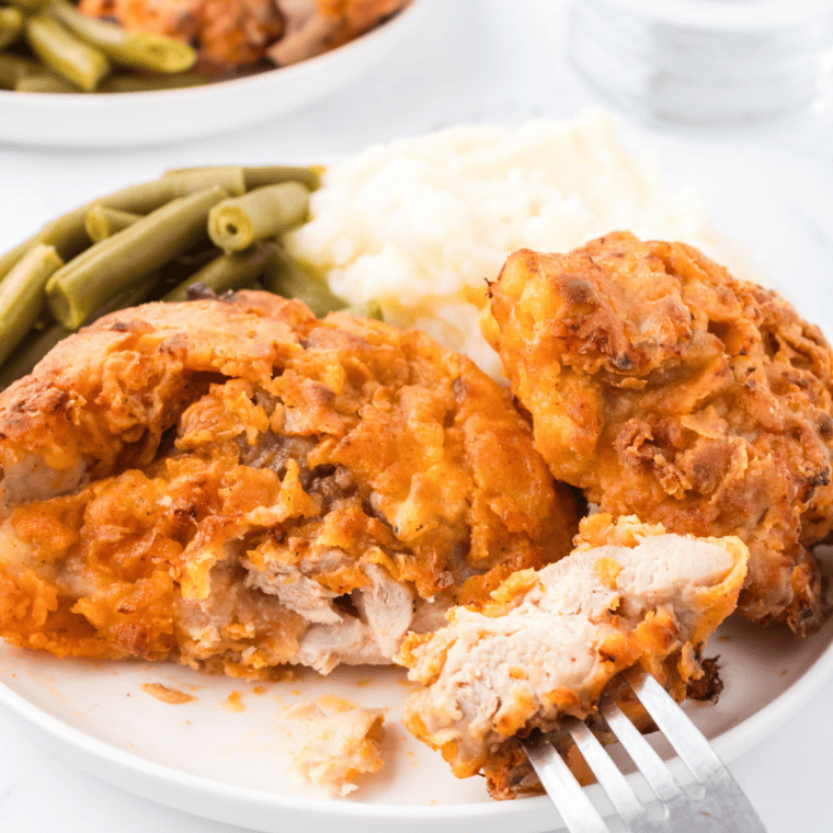 "Crispy and golden Air Fryer Cracker Barrel Southern Fried Chicken served on a rustic wooden platter."