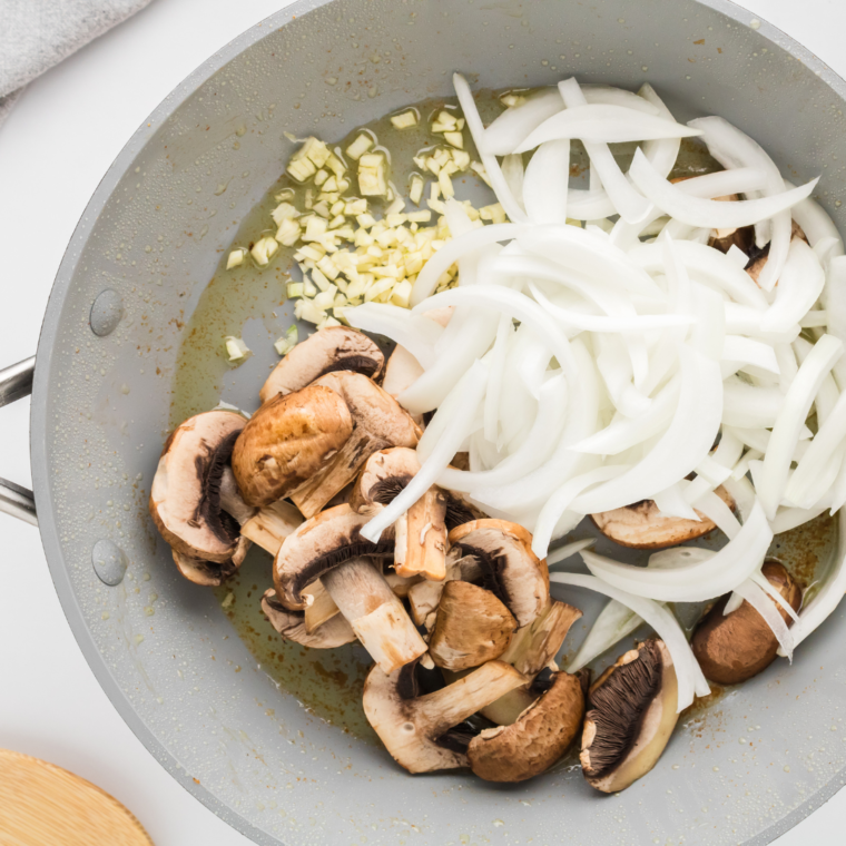 Prepare the sauteed mushrooms and onions for the topping.