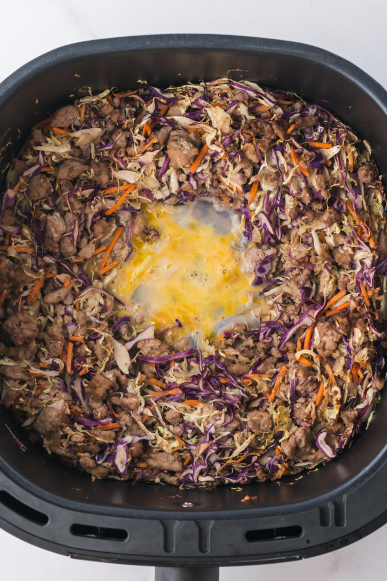 Air Fryer Basket sautéed meat and vegetables, creating the filling for the egg roll bowl.