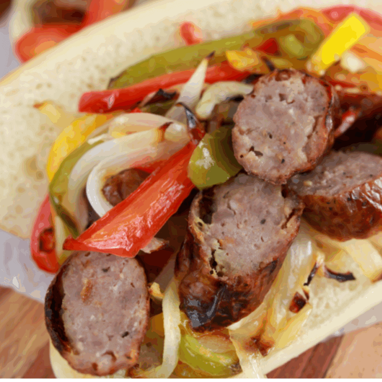 Golden Corral Sausage and Peppers copycat with seared sausage, red and green bell peppers, and onions served in a skillet.