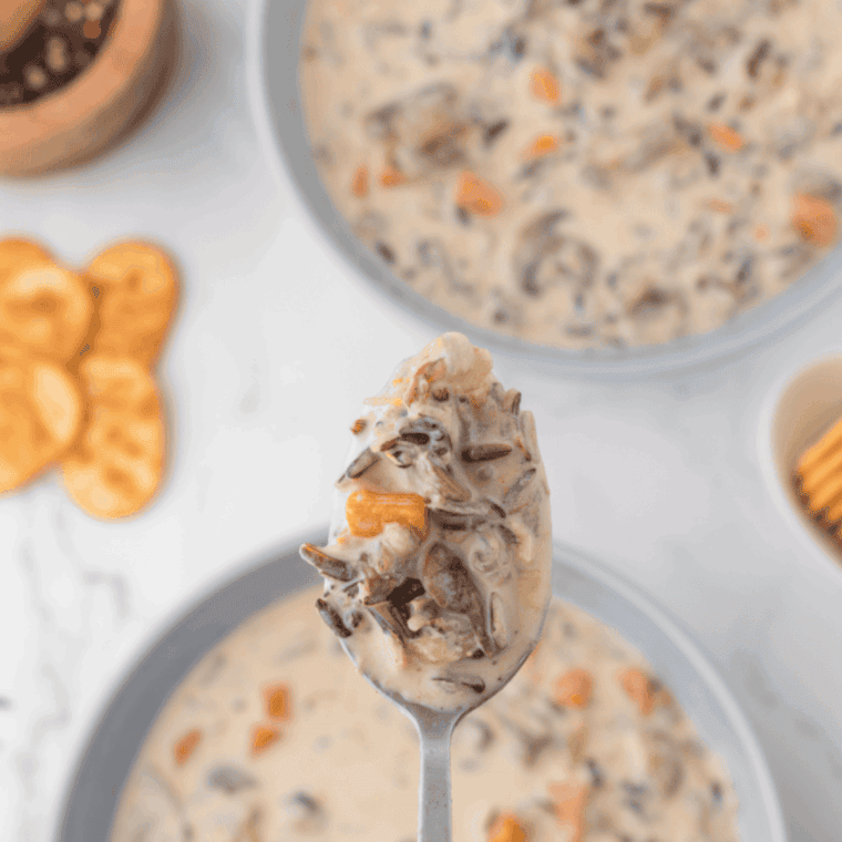 Creamy, hearty, in-a-bowl but so much better-than-Panera-bread copycat chicken wild rice soup in the Instant Pot, topped with fresh parsley and steaming hot.