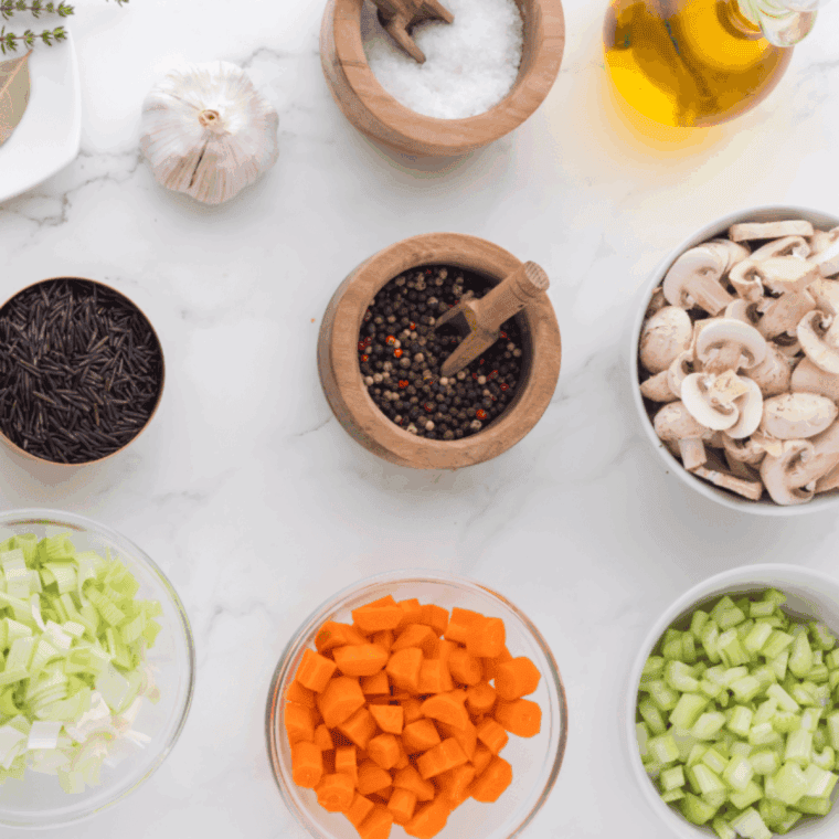 Ingredients needed for Instant Pot Panera Bread Chicken Wild Rice Soup on kitchen table.