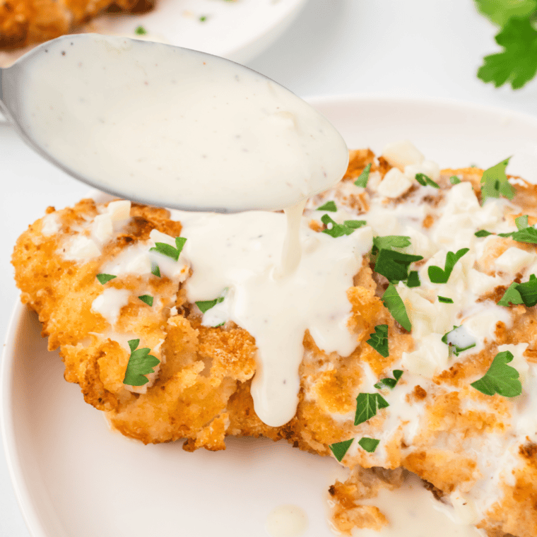 Close-up of homemade Chicken Scampi garnished with fresh parsley.