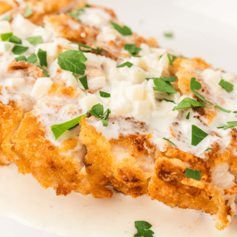 Serving pasta with creamy garlic sauce for Olive Garden Chicken Scampi recipe.