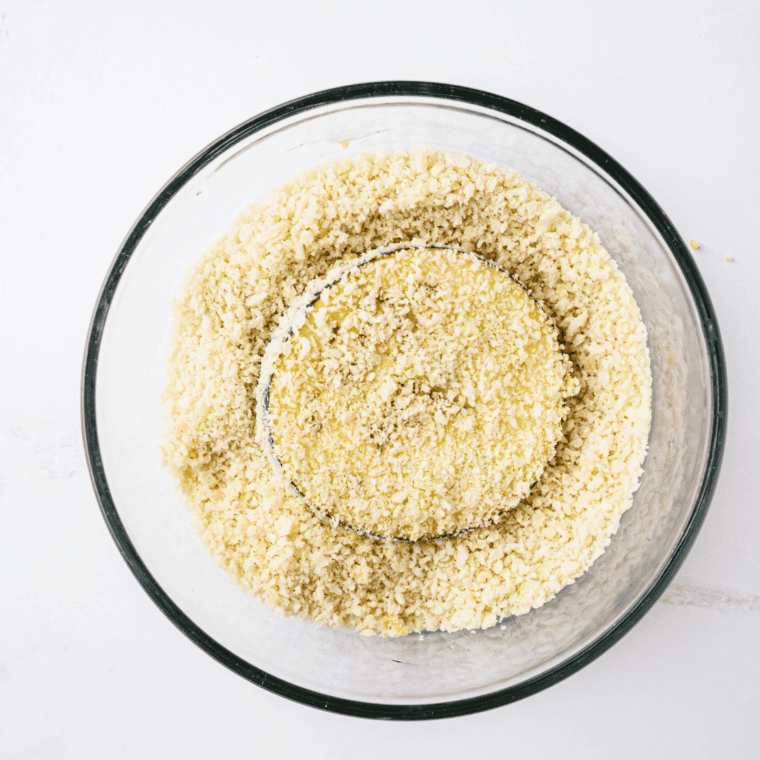 Coating eggplant slices in breadcrumbs for Olive Garden's Eggplant Parmesan.