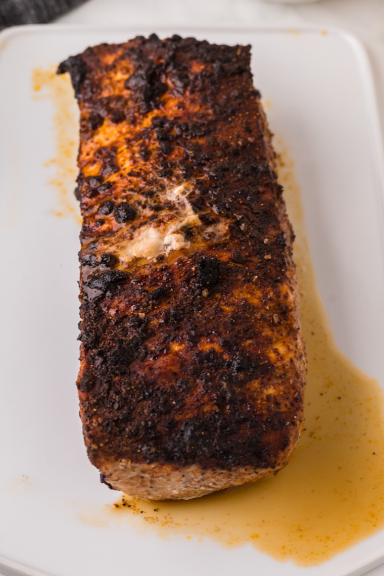 Juicy, sliced pork tenderloin cooked in a Ninja Foodi, ready to serve