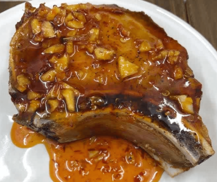 Juicy reheated pork chops in an air fryer, perfectly crisp and tender