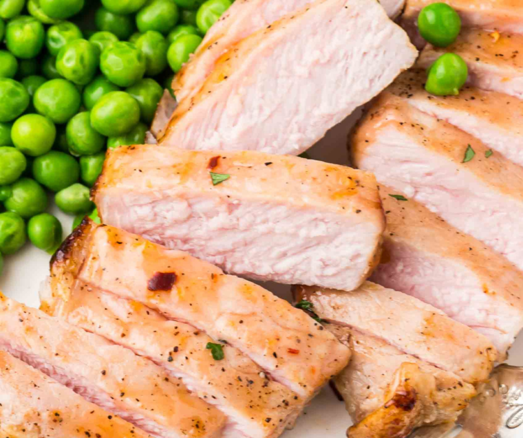 Close-up of juicy air fryer apricot pork chops with caramelized sweet apricot glaze