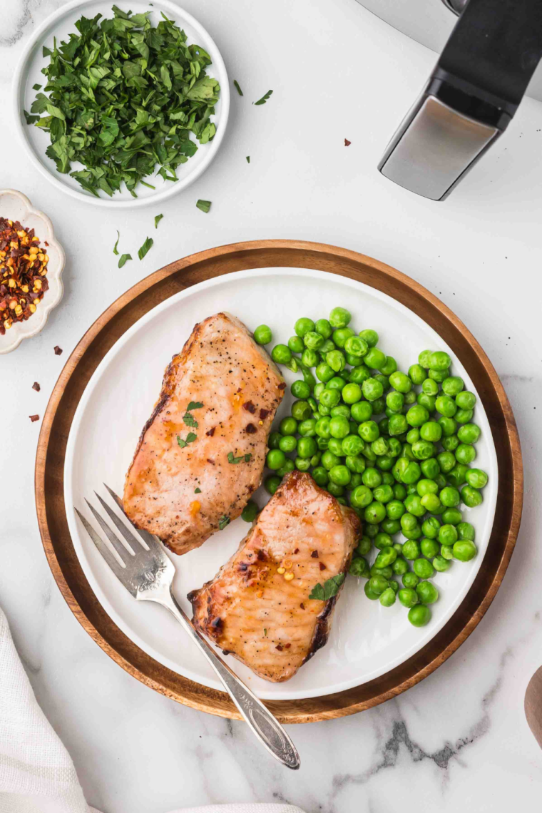 Air fryer apricot pork chops plated for a quick and easy family dinner