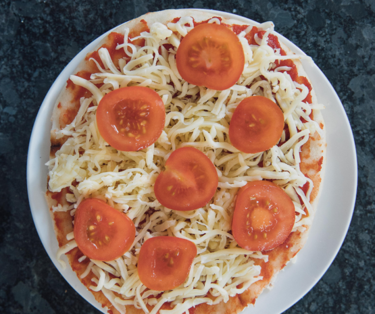 Add toppings to the flatbread pizza.