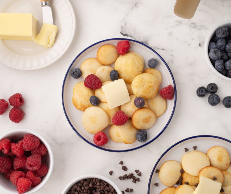 Crispy, bite-sized Air Fryer pancake cereal served in a bowl with syrup, ready to enjoy as a fun breakfast.