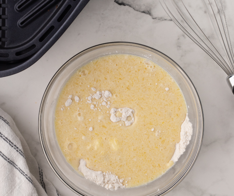 Lightly spraying the air fryer basket with cooking spray to prevent pancake cereal from sticking.