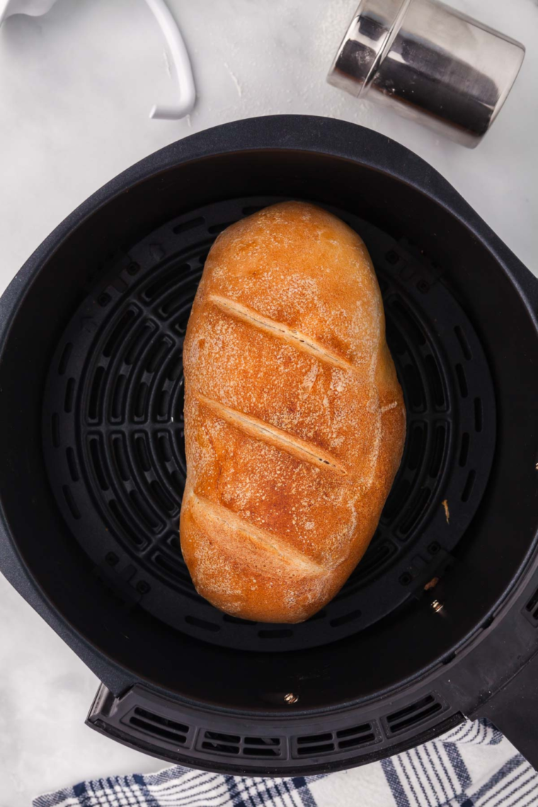 Sliced air fryer sourdough bread showing soft chewy interior and crispy crust