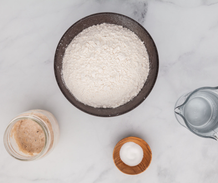 Air fryer sourdough bread ingredients including flour, salt, water, and active starter