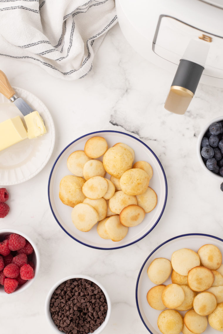A delicious bowl of crispy Air Fryer pancake cereal topped with maple syrup and fresh fruit.