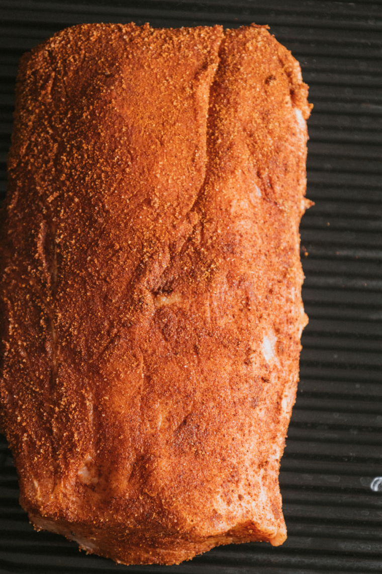 Seasoned pork tenderloin placed on a preheated Ninja Foodi Grill with lid closed