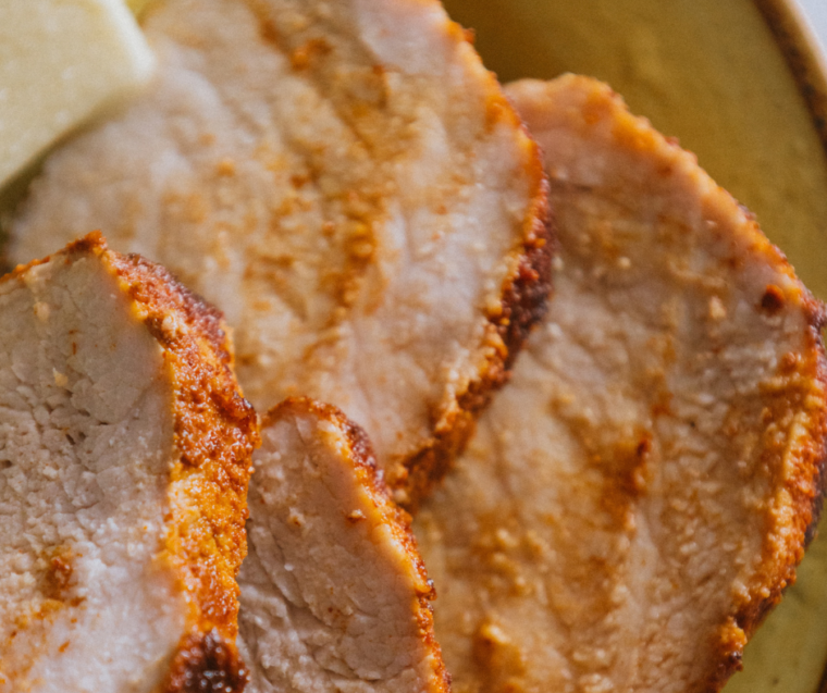 Sliced pork tenderloin cooked in a Ninja Foodi Grill, juicy and perfectly char-grilled