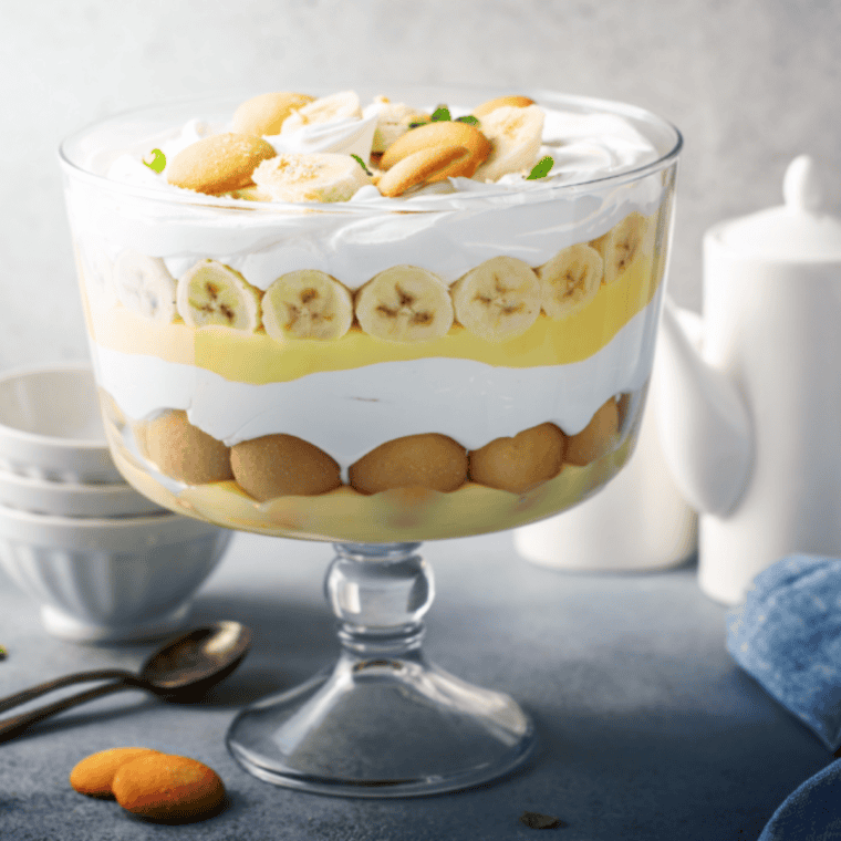 Cracker Barrel Banana Pudding layered with vanilla wafers, bananas, and whipped topping in a glass dish
