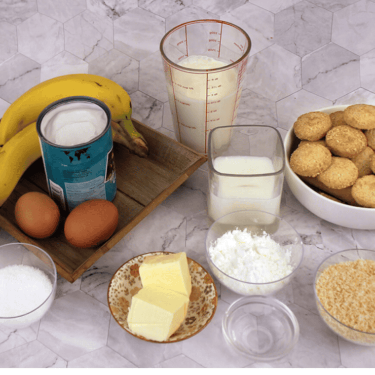 Ingredients needed for Cracker Barrel Banana Pudding on kitchen table.