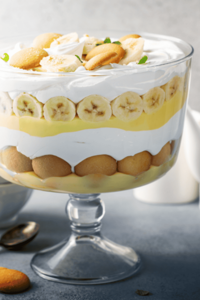 Delicious Cracker Barrel Banana Pudding topped with whipped cream, banana slices, and vanilla wafers