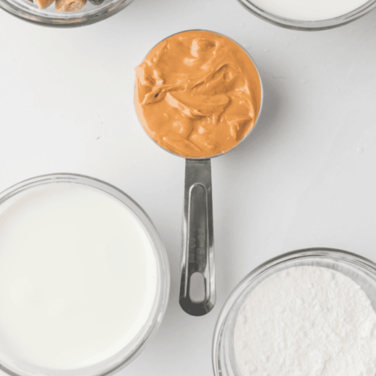 Ingredients needed for Ninja Creami Reese's Ice Cream on kitchen table.