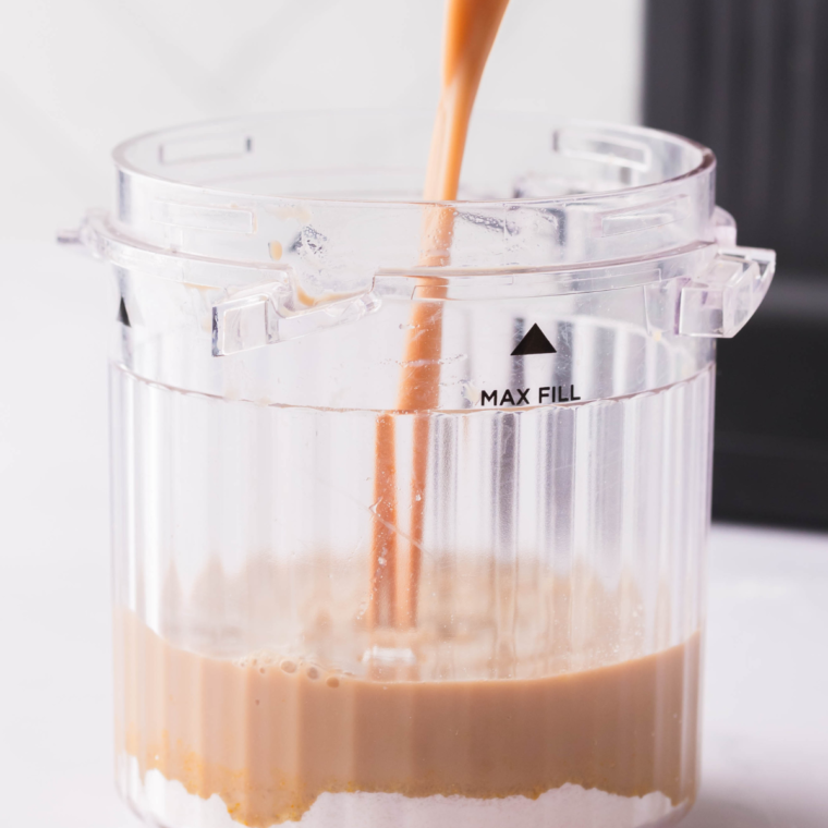 Whisk Starbucks Frappuccino Mocha Iced Coffee and pudding mix in Ninja Creami pint bowl until smooth and fully dissolved."