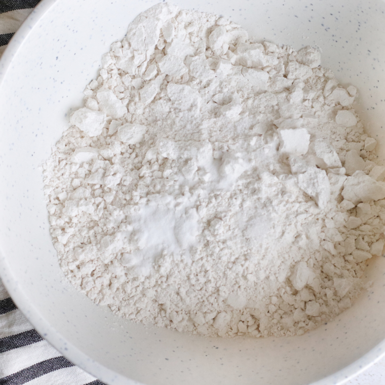 Mixing bowl, filled with Air Fryer Snowball Cookies ingredients.
