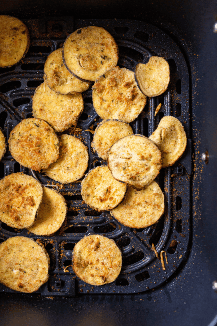 Crispy air fryer eggplant chips in a basket, golden brown and ready to serve.