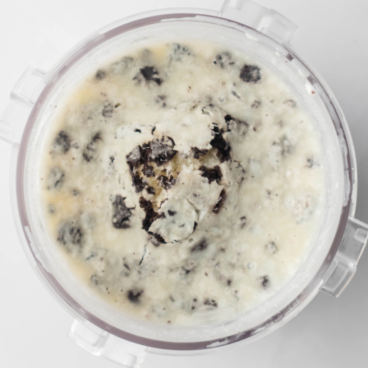 Frozen ookies And Cream Ninja Creami Protein Ice Cream in the ninja creami pint container.