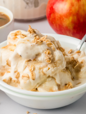 "Close-up of a bowl of Ninja Creami Apple Cobbler Ice Cream with spiced apples and a creamy, smooth texture."