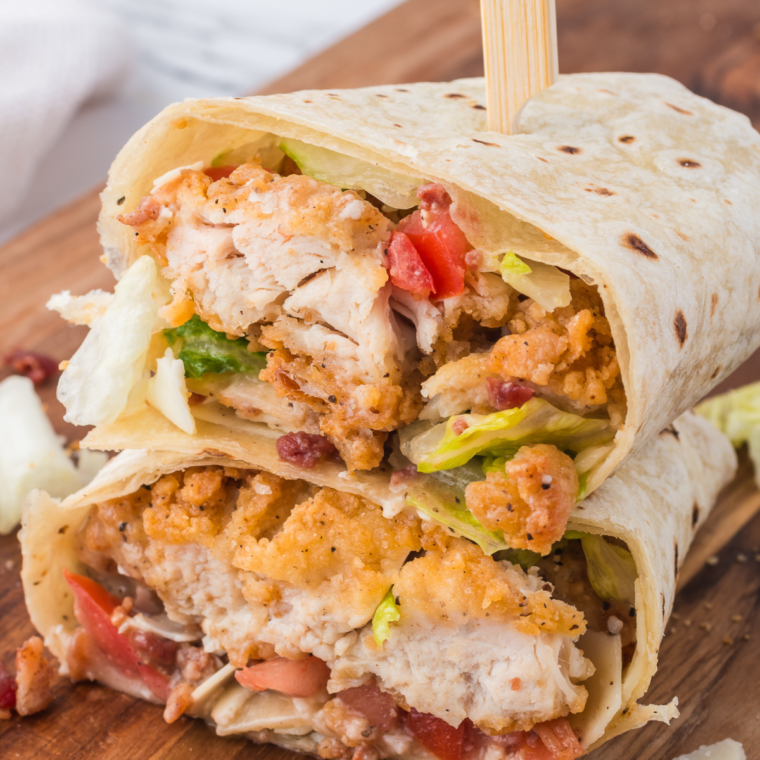 Crispy chicken Caesar wrap with fresh romaine, shaved Parmesan, and creamy Caesar dressing