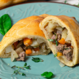 Golden, flaky Air Fryer Cornish Pastry with a savory meat and vegetable filling."