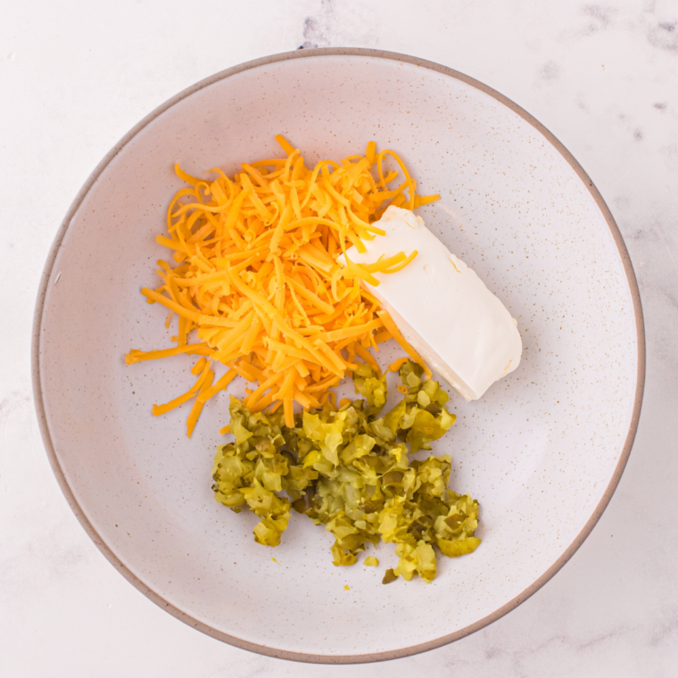 Cheddar cheese added to the pickle ball mixture for a cheesy flavor.