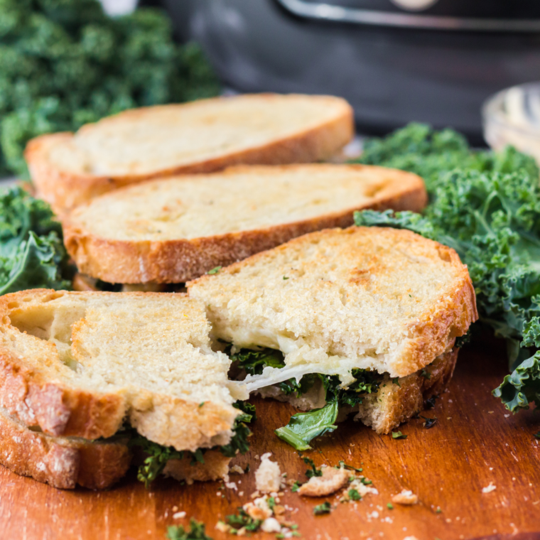 Air Fryer Provolone Broccoli Rabe Sandwich with melted provolone cheese, sautéed broccoli rabe, and a crispy, toasted bun.