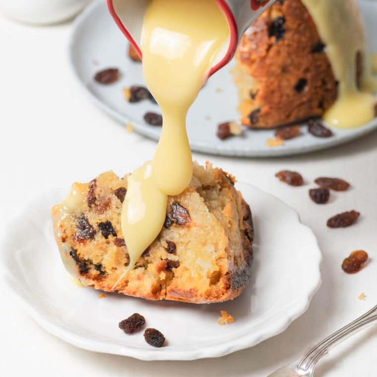 Golden, fluffy Air Fryer Spotted Dick served warm with currants.