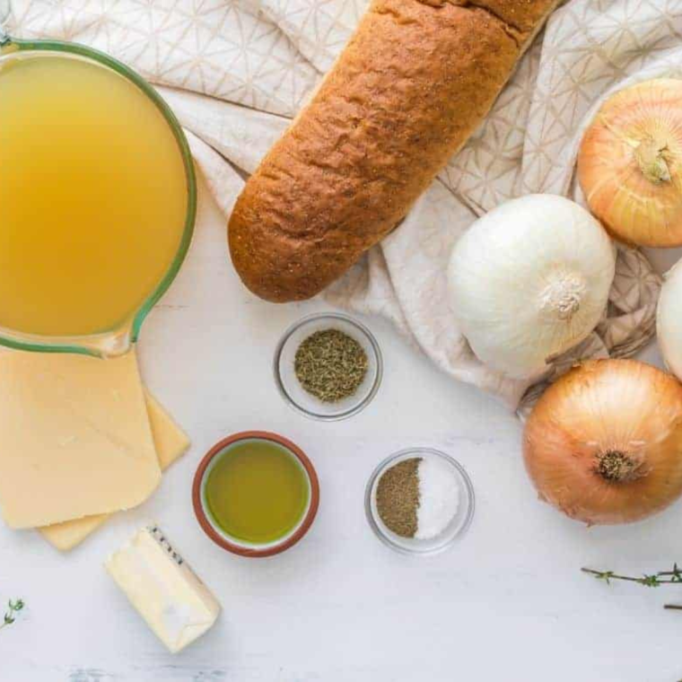 Ingredients for Longhorn French onion soup: onions, beef broth, butter, Gruyère, baguette, and thyme