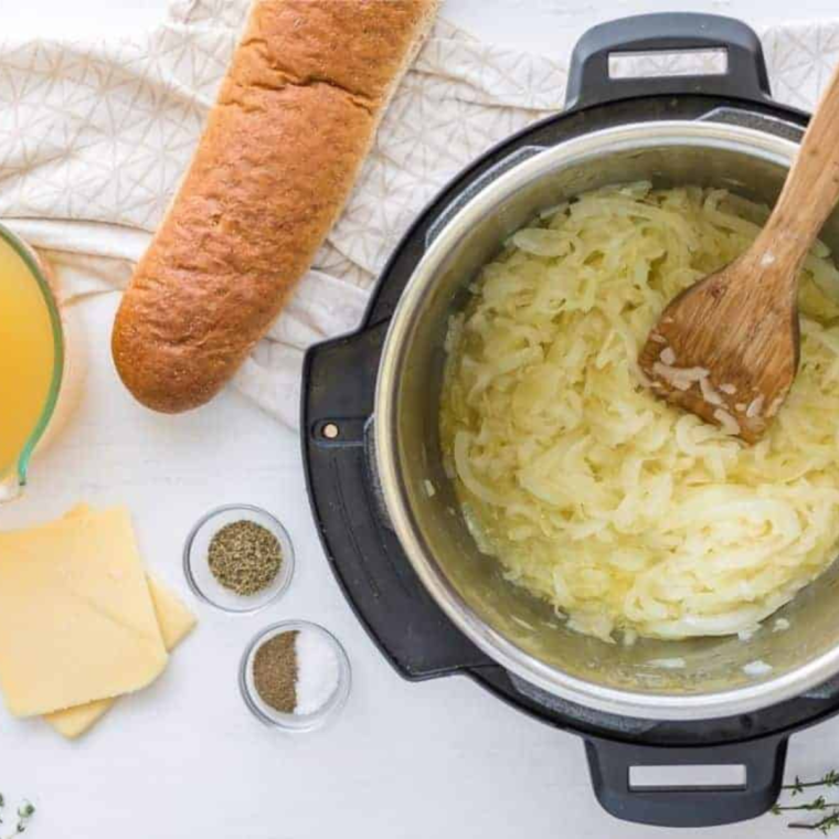 Thinly sliced onions caramelizing to deep golden brown in a Dutch oven for French onion soup