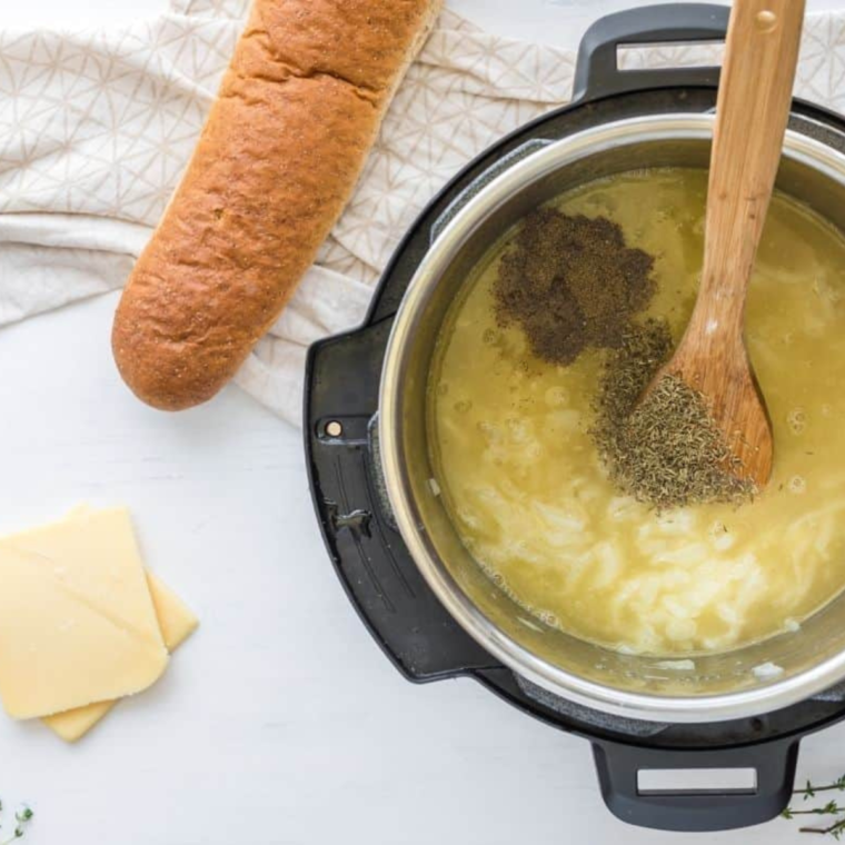 Beef broth stirred into caramelized onions to build the savory French onion soup base