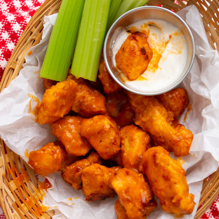 Homemade Longhorn spicy chicken bites with crispy breading and ranch dipping sauce on the side