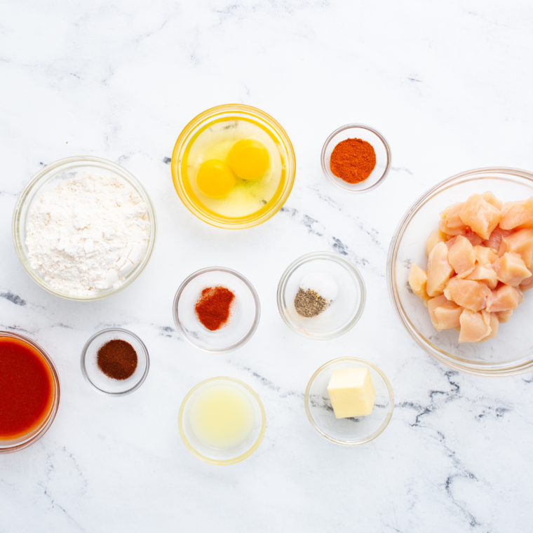 Ingredients for Longhorn spicy chicken bites: chicken, flour, cornstarch, spices, hot sauce, butter, and honey